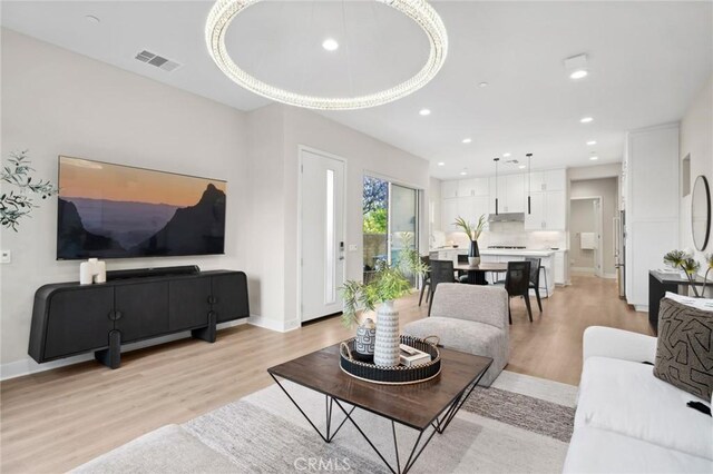 160 Mirth, Irvine, CA 92618 - living area featuring light wood-style floors and recessed lighting