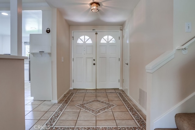 25001 Mackenzie St, Laguna Hills, CA 92653 - entrance foyer featuring stairs, inlaid floor details, and light tile patterned flooring