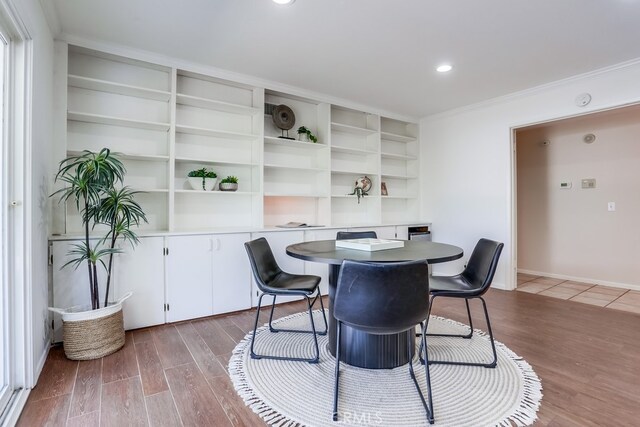 25001 Mackenzie St, Laguna Hills, CA 92653 - dining room with wood finished floors, crown molding, and recessed lighting