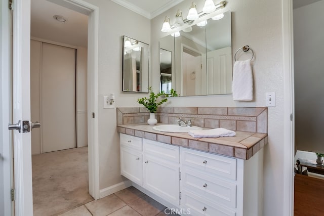 25001 Mackenzie St, Laguna Hills, CA 92653 - bathroom with ornamental molding, vanity, and tile patterned floors