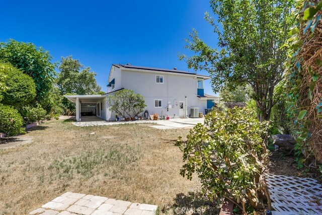 25001 Mackenzie St, Laguna Hills, CA 92653 - rear view of house featuring stucco siding and a patio area