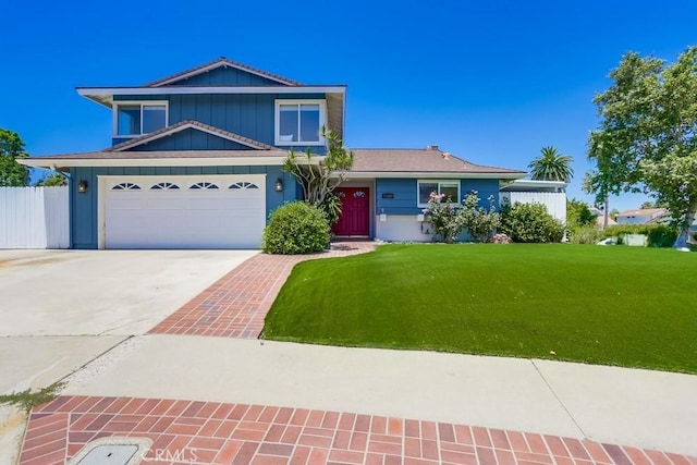 25001 Mackenzie St, Laguna Hills, CA 92653 - view of front of home featuring board and batten siding, driveway, and an attached garage