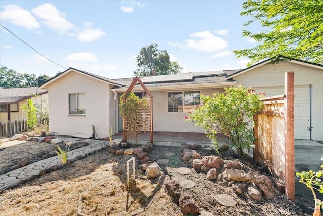 6685 Navajoa Ave, Atascadero, CA 93422 - ranch-style home with roof mounted solar panels and stucco siding