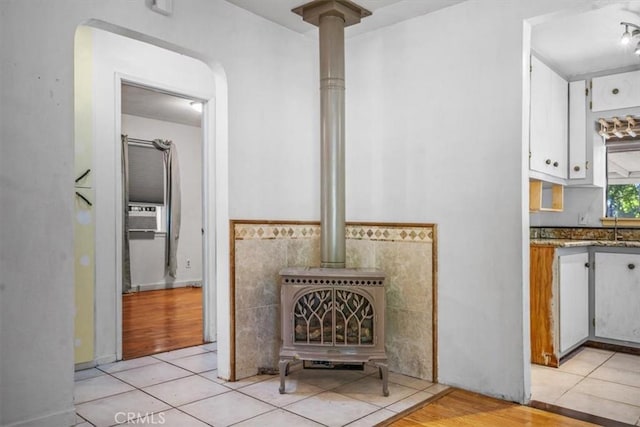 6685 Navajoa Ave, Atascadero, CA 93422 - detailed view of a wood stove, cooling unit, and wood finished floors