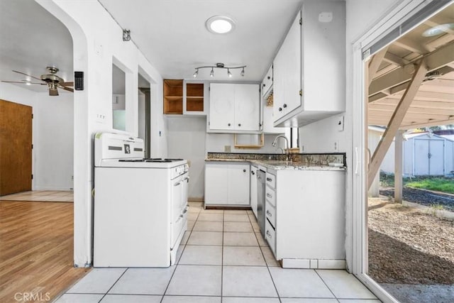 6685 Navajoa Ave, Atascadero, CA 93422 - kitchen with white range, white cabinets, a ceiling fan, dishwasher, and light tile patterned floors