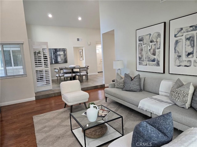 868 Ethelinda Way, Brea, CA 92821 - living area featuring wood finished floors, a high ceiling, and recessed lighting
