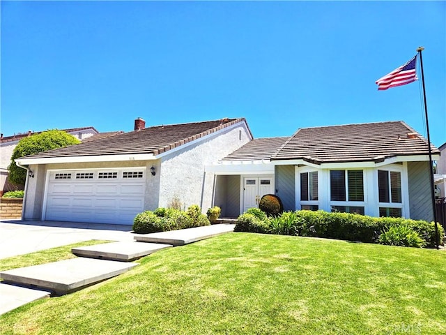 868 Ethelinda Way, Brea, CA 92821 - ranch-style home featuring a garage, driveway, a front lawn, and a tiled roof