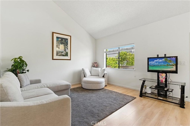 39239 Walnut Ter, Fremont, CA 94536 - living area with light wood finished floors, lofted ceiling, and a textured ceiling