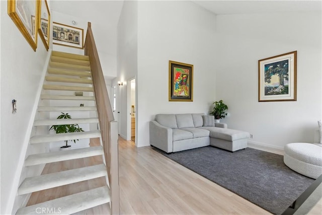 39239 Walnut Ter, Fremont, CA 94536 - living room with stairs, a towering ceiling, and light wood finished floors