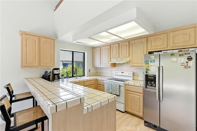39239 Walnut Ter, Fremont, CA 94536 - kitchen featuring stainless steel fridge, white electric range oven, light brown cabinets, and tile counters