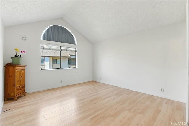39239 Walnut Ter, Fremont, CA 94536 - unfurnished room featuring lofted ceiling, wood finished floors, and a textured ceiling