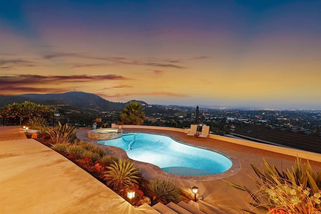 1966 Las Lomas, Vista, CA 92084 - pool at dusk with a pool with connected hot tub, a mountain view, and a patio area