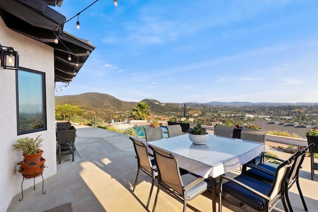 1966 Las Lomas, Vista, CA 92084 - view of patio featuring a mountain view, outdoor dining space, and an infinity pool