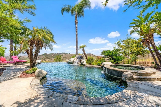 43110 Palomino Cir, Temecula, CA 92590 - view of swimming pool featuring a pool with connected hot tub and a patio