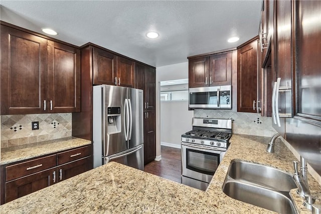 960 Golden Springs Dr Unit G, Diamond Bar, CA 91765 - kitchen with appliances with stainless steel finishes, light stone countertops, dark wood-type flooring, decorative backsplash, and recessed lighting
