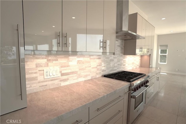 2615 Temple Hills Dr, Laguna Beach, CA 92651 - kitchen featuring wall chimney range hood, high end stove, tasteful backsplash, recessed lighting, and white cabinetry