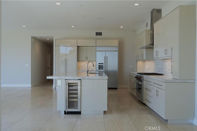 2615 Temple Hills Dr, Laguna Beach, CA 92651 - kitchen with premium appliances, beverage cooler, backsplash, light countertops, and recessed lighting
