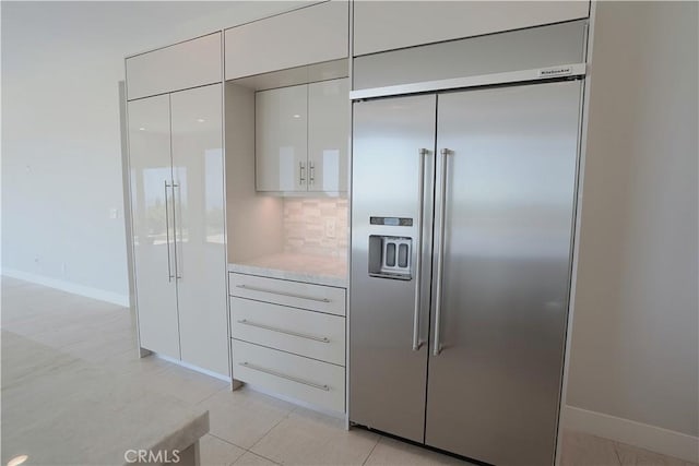 2615 Temple Hills Dr, Laguna Beach, CA 92651 - kitchen featuring built in refrigerator, modern cabinets, light countertops, white cabinets, and backsplash