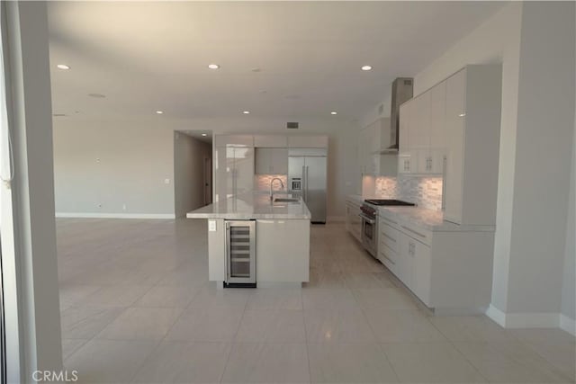 2615 Temple Hills Dr, Laguna Beach, CA 92651 - kitchen with premium appliances, beverage cooler, wall chimney range hood, decorative backsplash, and recessed lighting
