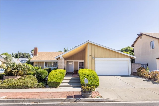 2217 E Brower St, Simi Valley, CA 93065 - view of front of property featuring an attached garage, driveway, and a chimney