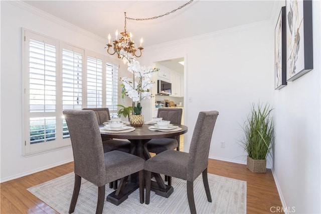 2217 E Brower St, Simi Valley, CA 93065 - dining space with a chandelier, light wood-style floors, and crown molding