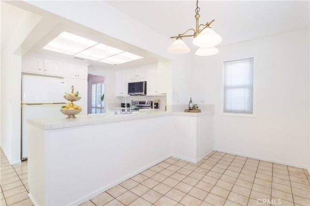 2217 E Brower St, Simi Valley, CA 93065 - kitchen featuring appliances with stainless steel finishes, a chandelier, a peninsula, white cabinets, and light tile patterned floors