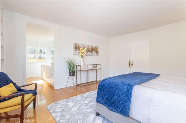 2217 E Brower St, Simi Valley, CA 93065 - bedroom featuring light wood finished floors, ensuite bathroom, and a closet
