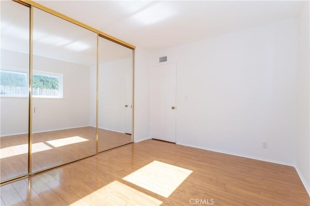 2217 E Brower St, Simi Valley, CA 93065 - unfurnished bedroom with wood finished floors and a closet