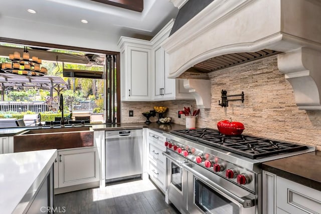 5329 Shirley Ave, Tarzana, CA 91356 - kitchen featuring appliances with stainless steel finishes, custom exhaust hood, backsplash, white cabinetry, and wood finished floors