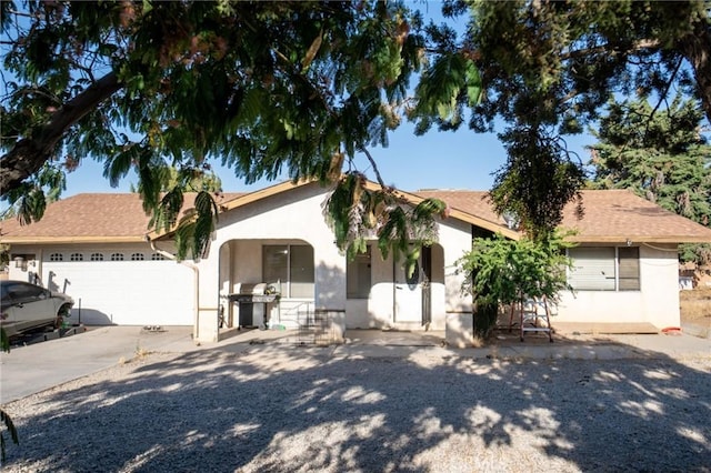 7323 Oakwood Ave, Hesperia, CA 92345 - view of front of property featuring stucco siding, an attached garage, and concrete driveway