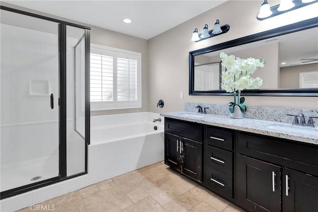 8383 Buckthorn Ave, Hesperia, CA 92345 - full bathroom featuring double vanity, a bath, and a stall shower