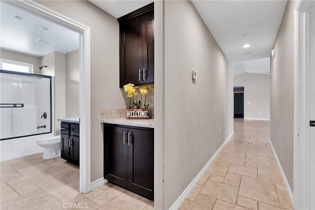 8383 Buckthorn Ave, Hesperia, CA 92345 - hall with stone tile flooring and recessed lighting