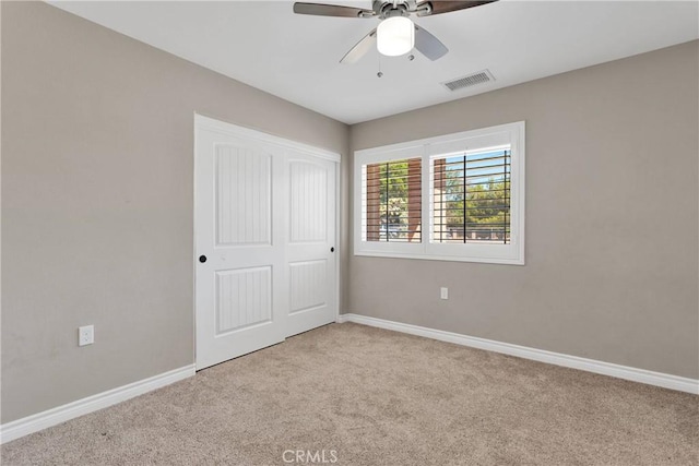 8383 Buckthorn Ave, Hesperia, CA 92345 - unfurnished bedroom featuring carpet floors, a closet, and a ceiling fan