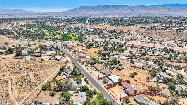 8383 Buckthorn Ave, Hesperia, CA 92345 - aerial view of property and surrounding area featuring a mountain backdrop and property parcel outlined