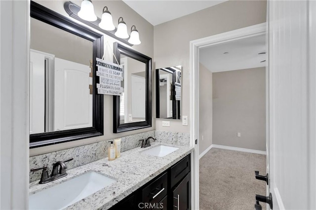 8383 Buckthorn Ave, Hesperia, CA 92345 - full bathroom with double vanity and baseboards