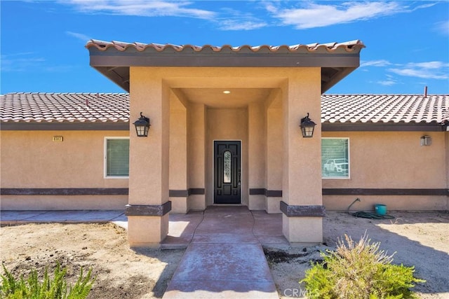 8383 Buckthorn Ave, Hesperia, CA 92345 - doorway to property with stucco siding and a tiled roof
