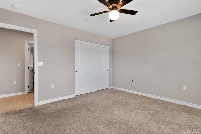 8383 Buckthorn Ave, Hesperia, CA 92345 - unfurnished bedroom featuring light colored carpet, a closet, and a ceiling fan