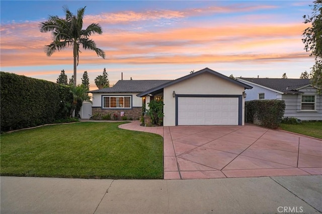 481 S Cedar Dr, Covina, CA 91723 - view of front of house featuring stucco siding, an attached garage, driveway, a lawn, and stone siding