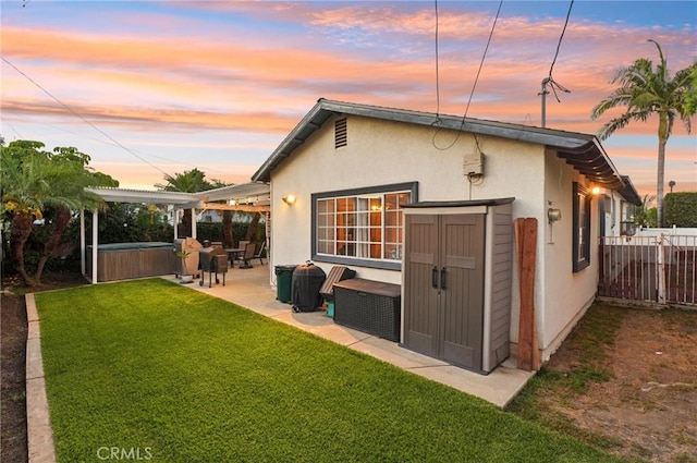 481 S Cedar Dr, Covina, CA 91723 - rear view of house with a hot tub, a patio, stucco siding, and an outdoor structure