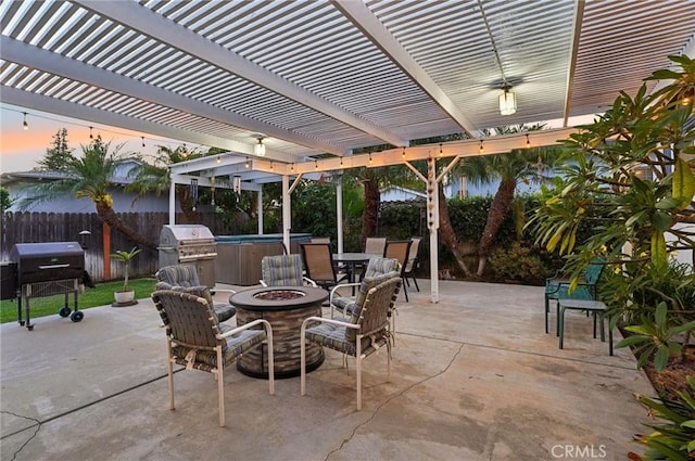 481 S Cedar Dr, Covina, CA 91723 - patio terrace at dusk featuring a hot tub, a fenced backyard, an outdoor fire pit, and grilling area