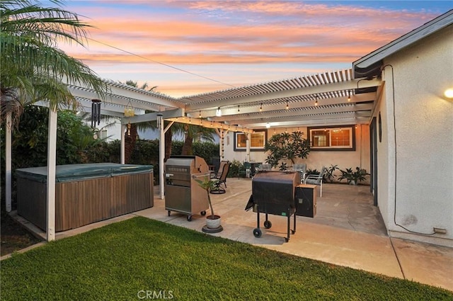 481 S Cedar Dr, Covina, CA 91723 - patio terrace at dusk with a hot tub, a pergola, a patio, and a yard