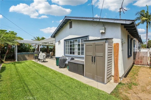 481 S Cedar Dr, Covina, CA 91723 - back of property with a hot tub, a patio area, stucco siding, and an outdoor structure