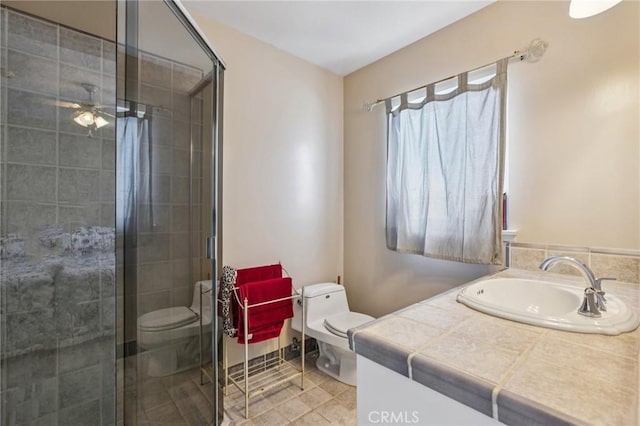 481 S Cedar Dr, Covina, CA 91723 - full bathroom with vanity, a stall shower, and a ceiling fan