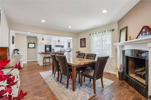 481 S Cedar Dr, Covina, CA 91723 - dining room featuring dark wood-type flooring, a premium fireplace, and recessed lighting