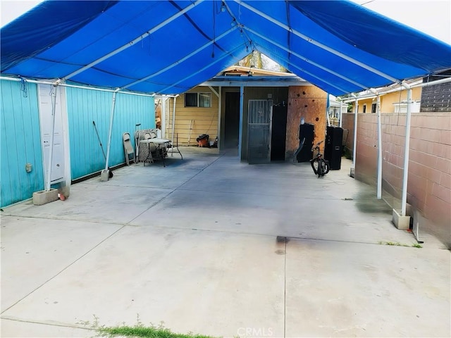 418 W 103rd St, Los Angeles, CA 90003 - view of patio featuring a carport
