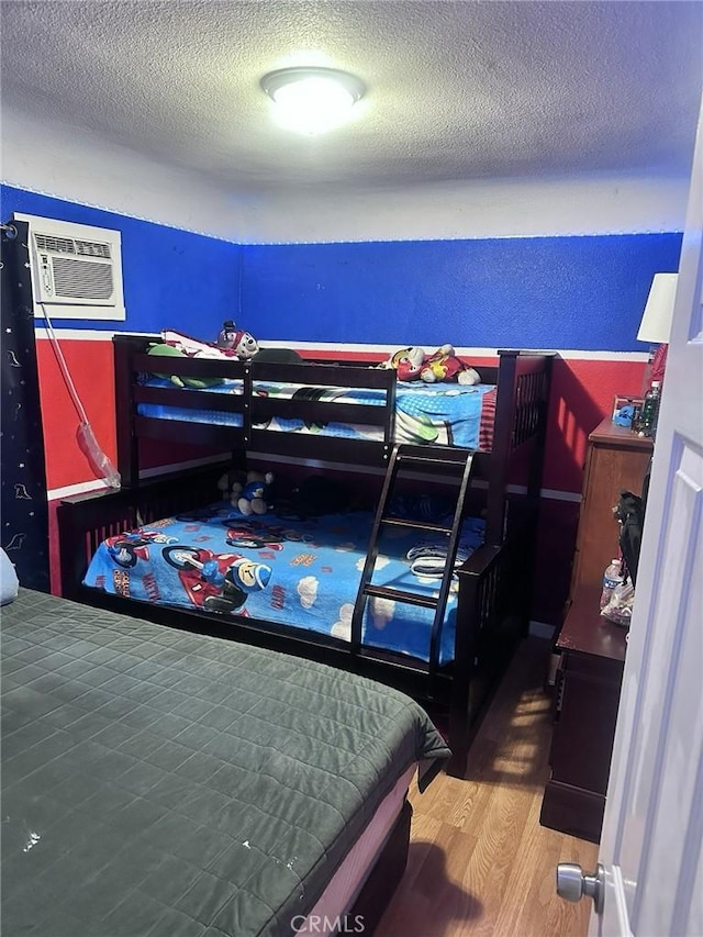 418 W 103rd St, Los Angeles, CA 90003 - bedroom with wood finished floors and a textured ceiling