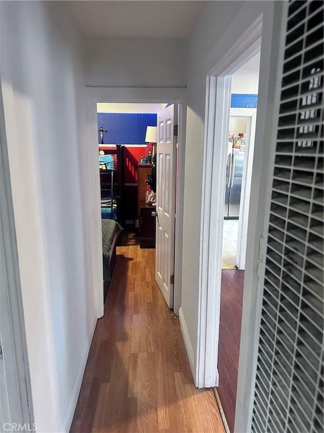 418 W 103rd St, Los Angeles, CA 90003 - hall with wood finished floors and a heating unit