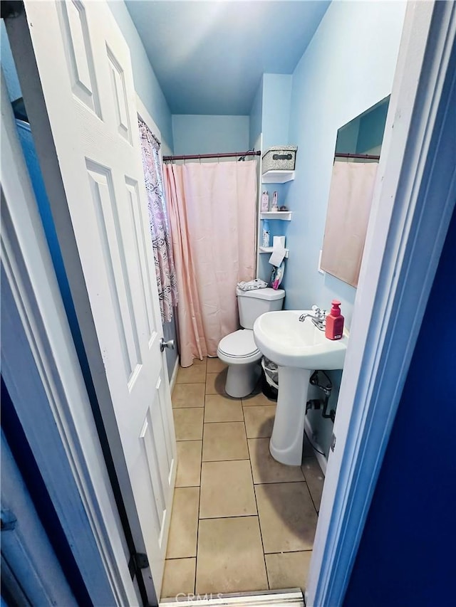 418 W 103rd St, Los Angeles, CA 90003 - bathroom with toilet and tile patterned flooring