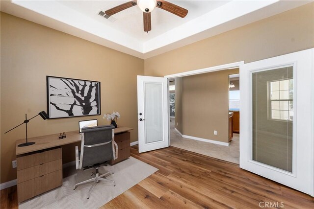 13212 Primavera Rd, Pinon Hills, CA 92372 - office space featuring a ceiling fan, wood finished floors, and a raised ceiling