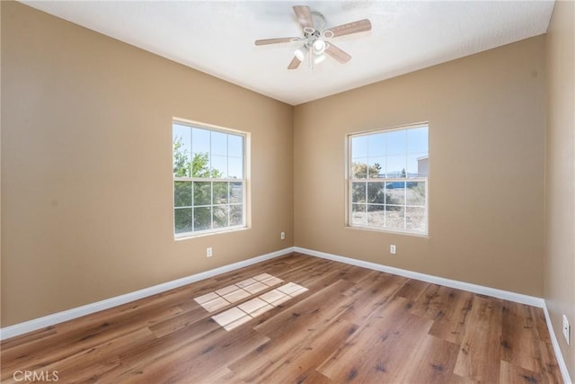 13212 Primavera Rd, Pinon Hills, CA 92372 - unfurnished room featuring wood finished floors and ceiling fan